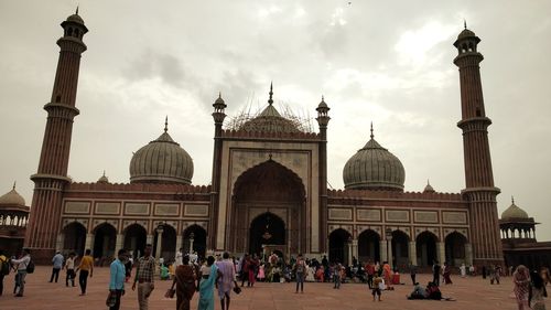 Group of people in front of historical building