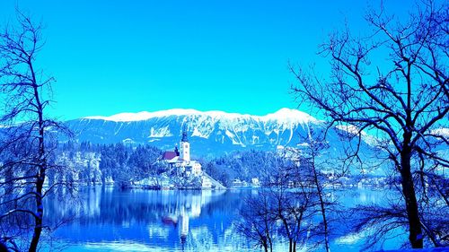 Scenic view of mountains against clear blue sky