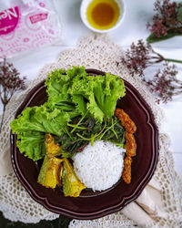 High angle view of vegetables in plate on table