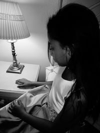 Close-up of young woman at home