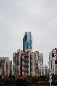 Low angle view of buildings against sky in city