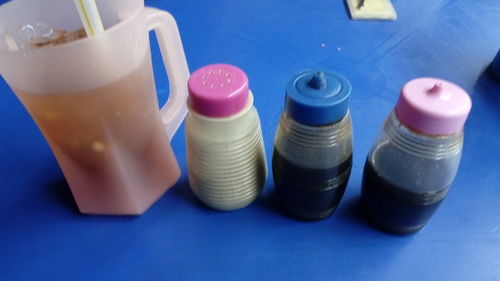 High angle view of bottles on table