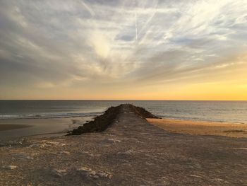 Scenic view of sea against sky at sunset