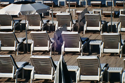 Lounge chairs arranged at beach