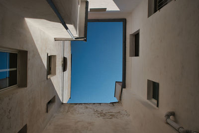 Low angle view of building against blue sky