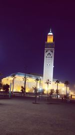 Illuminated building against sky at night