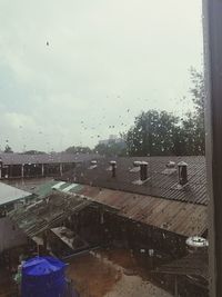 High angle view of wet glass window in rainy season