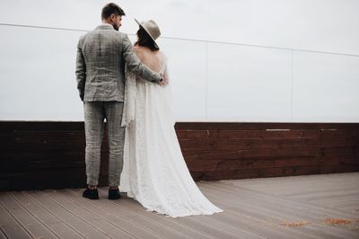 Bride and bridegroom on boardwalk