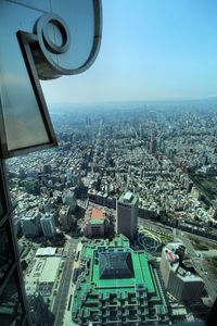 High angle view of buildings in city against sky