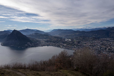 View of lugano and monte san salvatore, from monte bré