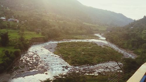 High angle view of river flowing through rocks