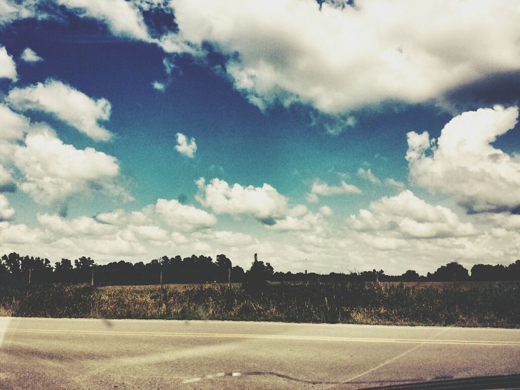 sky, cloud - sky, landscape, tree, cloudy, field, tranquil scene, tranquility, cloud, nature, scenics, beauty in nature, road, day, building exterior, built structure, outdoors, no people, rural scene, weather