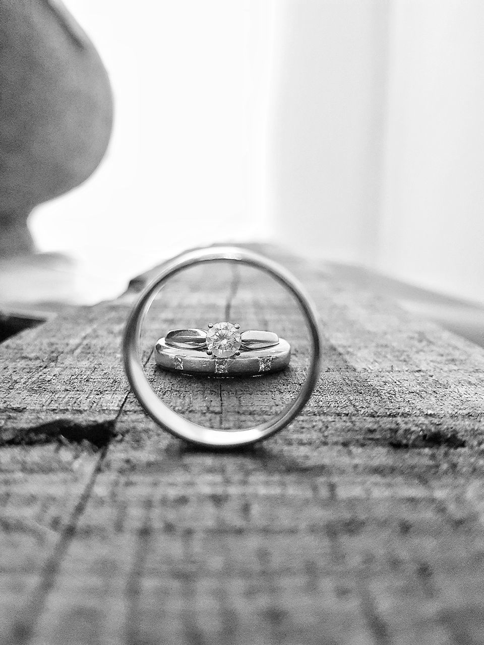 CLOSE-UP OF WEDDING RING ON TABLE