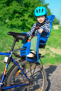 Portrait of boy riding bicycle