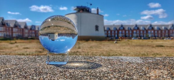 Close-up of crystal ball on land