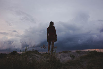 Scenic view of landscape against cloudy sky