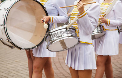 Musicians performing on street in city