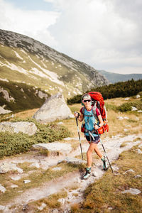 Rear view of man walking on mountain