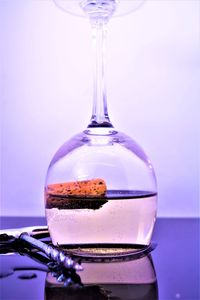 Close-up of glass of water against white background