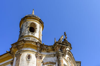 Low angle view of cathedral against clear blue sky