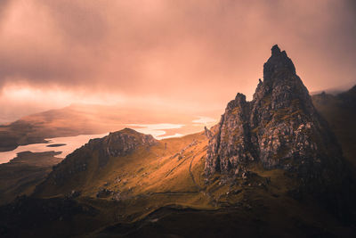 Scenic view of mountains against sky at sunset