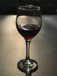 Close-up of wineglass on table