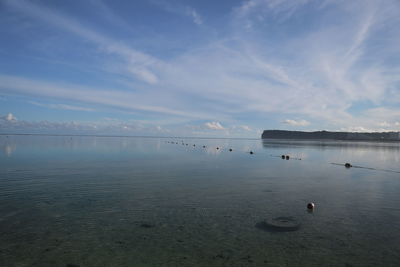 View of calm sea against cloudy sky