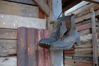 Classic style outdoor leather shoes hanging on the wall.