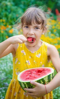 Portrait of cute girl eating food