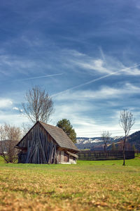 House on field against sky