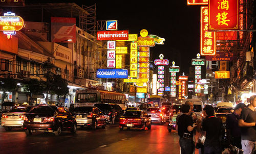 Illuminated city street at night