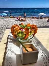 Close-up of seafood served on table at beach