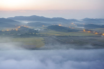 Scenic view of landscape against sky during sunset