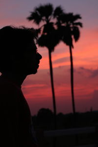 Close-up of silhouette man against sky during sunset