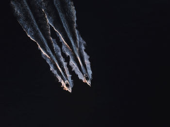 Low angle view of icicles against clear sky