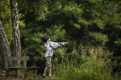 View of boy fishing