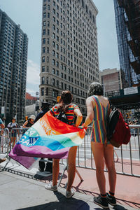 People against buildings in city