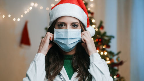 Doctor with mask on christmas background