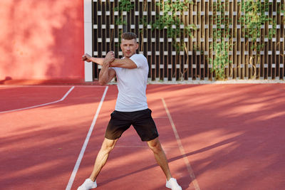 Low section of man playing soccer