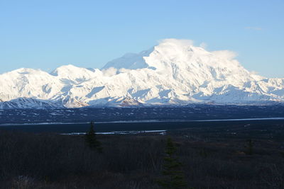 Scenic view of snowcapped mountains against sky