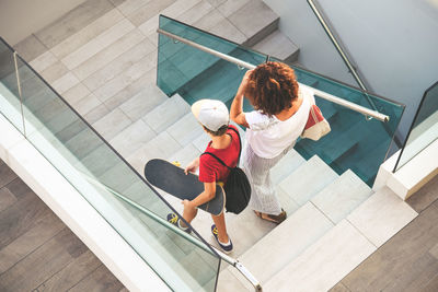 High angle view of friends on staircase