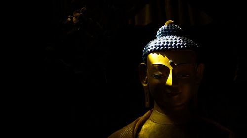 Close-up of buddha statue in temple