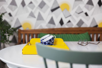 Tea cups in tray on table at home