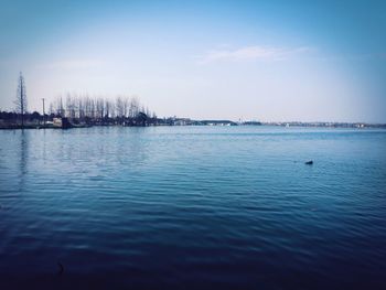 Scenic view of sea against blue sky