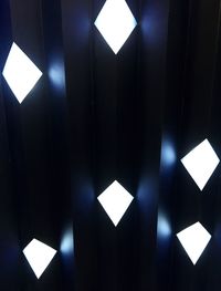 Low angle view of illuminated ceiling