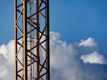 Low angle view of cables against blue sky