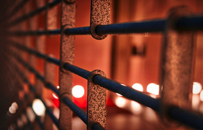 Close-up of metal fence against blurred background