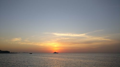 Scenic view of sea against sky during sunset