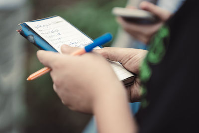 Close-up of man using mobile phone