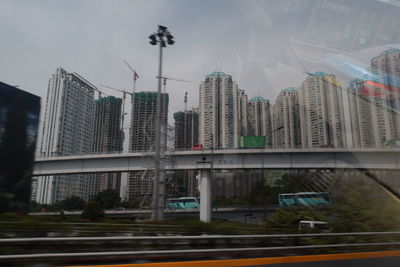 Modern buildings in city against sky